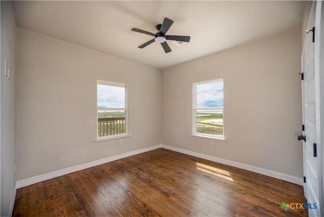193 Powderhorn Ln, Port Lavaca, TX 77979 - empty room with plenty of natural light, wood finished floors, and ceiling fan