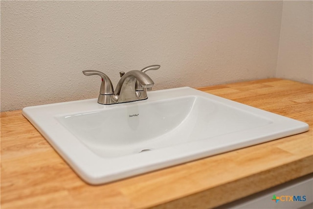 193 Powderhorn Ln, Port Lavaca, TX 77979 - bathroom view of a sink and a textured wall