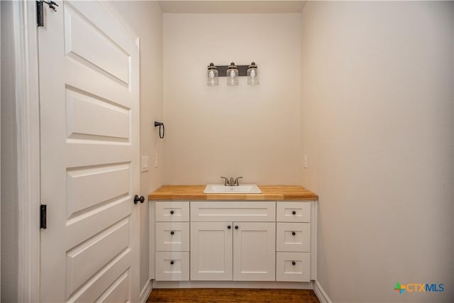 193 Powderhorn Ln, Port Lavaca, TX 77979 - bathroom with vanity and wood finished floors