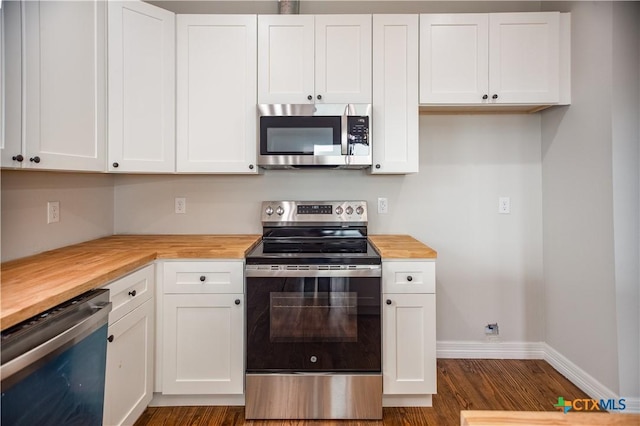193 Powderhorn Ln, Port Lavaca, TX 77979 - kitchen with stainless steel appliances, butcher block counters, white cabinetry, and dark wood-type flooring