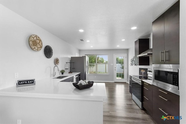 8606 Georgia Ave, Temple, TX 76502 - kitchen with light countertops, stainless steel appliances, a sink, and wood finished floors