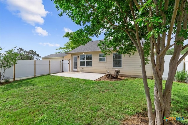 8606 Georgia Ave, Temple, TX 76502 - back of property with a patio, a fenced backyard, and a yard