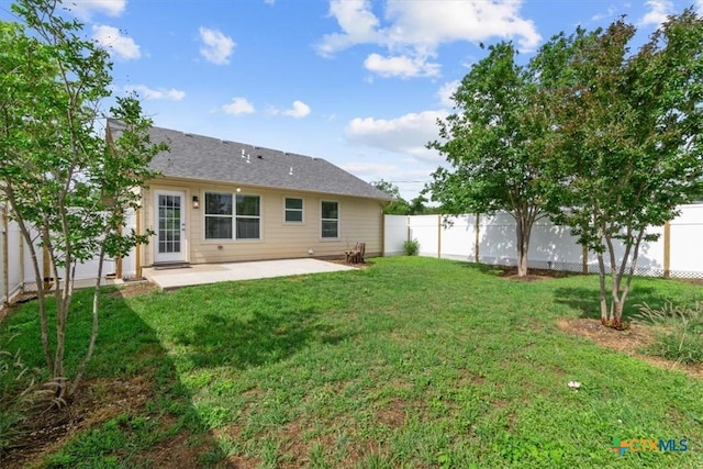8606 Georgia Ave, Temple, TX 76502 - rear view of house with a fenced backyard, a yard, and a patio area
