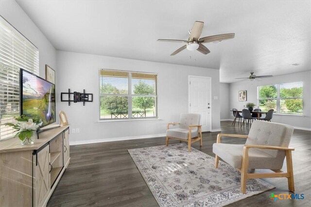 8606 Georgia Ave, Temple, TX 76502 - sitting room featuring baseboards, ceiling fan, and dark wood-type flooring