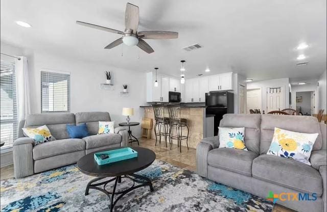 living room with ceiling fan