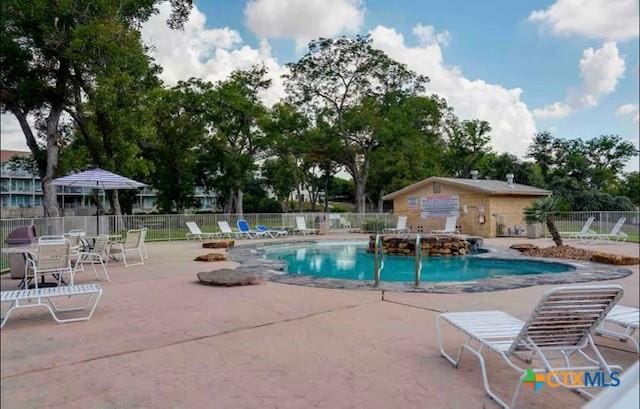 view of swimming pool featuring a patio area