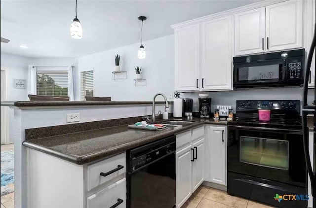 kitchen featuring pendant lighting, white cabinetry, black appliances, kitchen peninsula, and dark stone counters