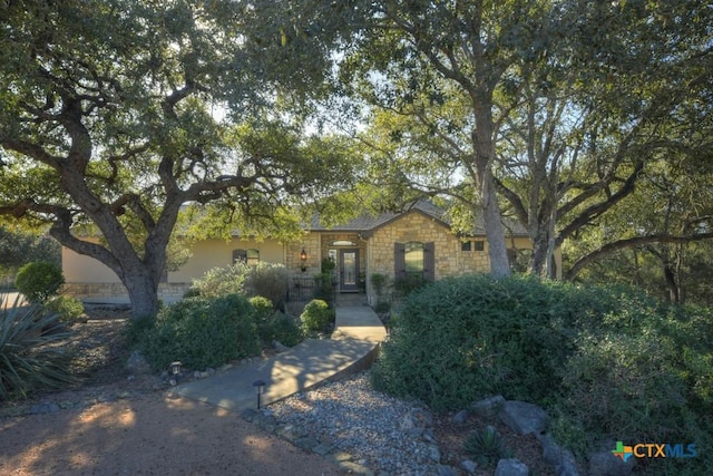 view of property hidden behind natural elements