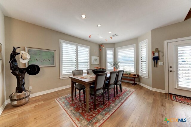 dining area featuring light wood-type flooring