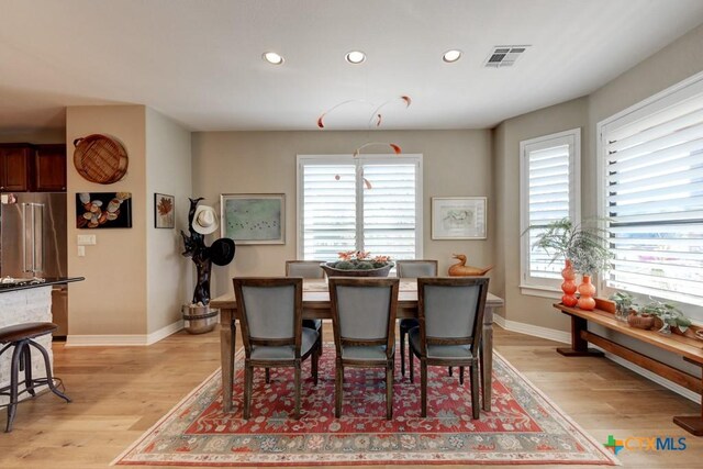 dining room with light hardwood / wood-style floors