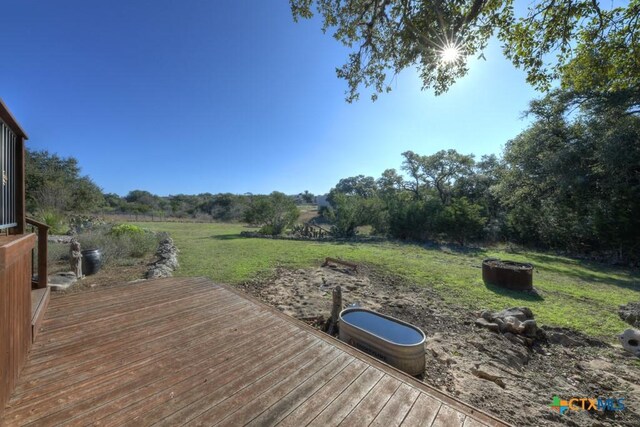 exterior space with a rural view and a deck