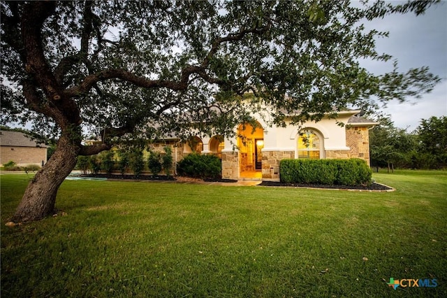 2618 Red Bud Way, New Braunfels, TX 78132 - view of property hidden behind natural elements with stone siding, a front lawn, and stucco siding