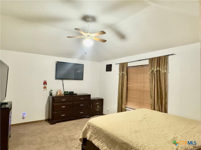 carpeted bedroom featuring ceiling fan and lofted ceiling