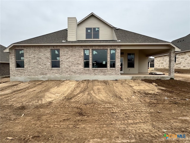 10818 Campsite Cv, Temple, TX 76502 - rear view of property with a patio, brick siding, roof with shingles, and a chimney