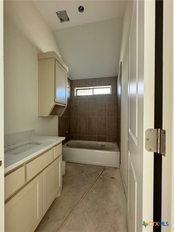 10818 Campsite Cv, Temple, TX 76502 - full bath with vanity, unfinished concrete flooring, a bath, a shower, and vaulted ceiling