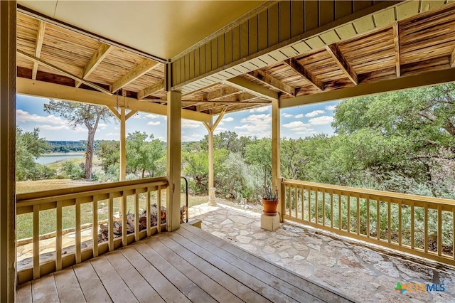 wooden deck with a water view