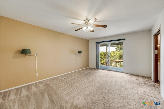 carpeted spare room with ceiling fan