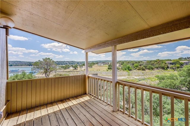 wooden deck with a water view