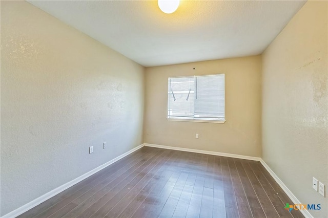 293 Reese Creek Rd, Killeen, TX 76549 - spare room featuring dark wood-style flooring and baseboards