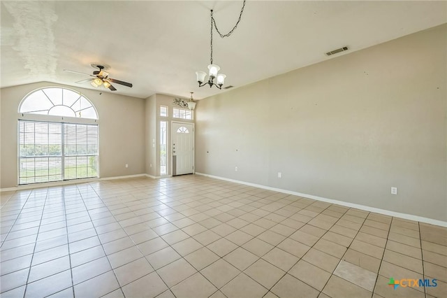 293 Reese Creek Rd, Killeen, TX 76549 - spare room with ceiling fan with notable chandelier, light tile patterned floors, vaulted ceiling, visible vents, and baseboards