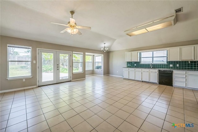 293 Reese Creek Rd, Killeen, TX 76549 - kitchen with black dishwasher, ceiling fan with notable chandelier, decorative backsplash, and vaulted ceiling
