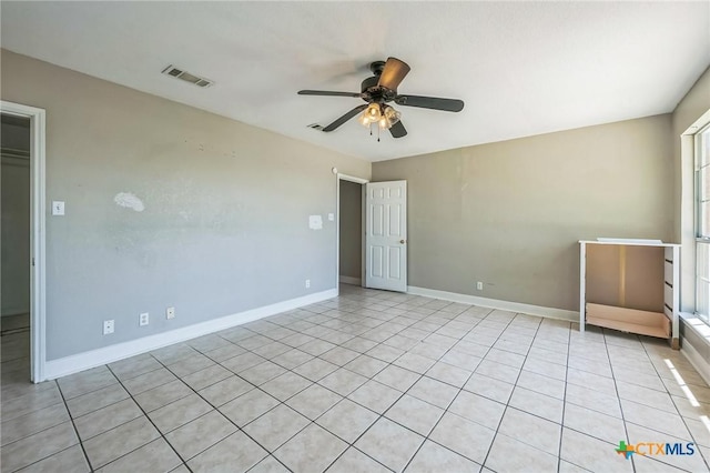 293 Reese Creek Rd, Killeen, TX 76549 - spare room featuring light tile patterned floors, visible vents, baseboards, and ceiling fan