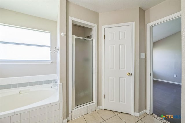 293 Reese Creek Rd, Killeen, TX 76549 - bathroom with a bath, a stall shower, baseboards, and tile patterned floors