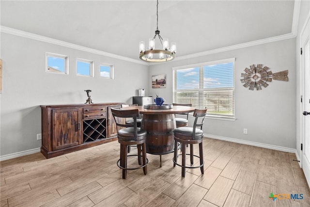 7511 Wind Chime Way, Temple, TX 76502 - dining space featuring crown molding, light wood-type flooring, and a chandelier