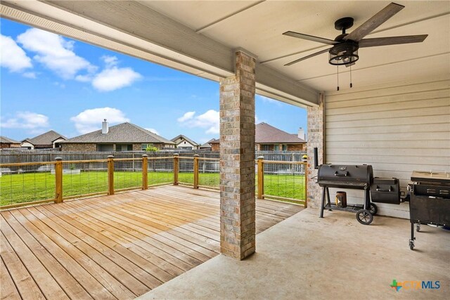 7511 Wind Chime Way, Temple, TX 76502 - wooden terrace featuring a fenced backyard, a ceiling fan, area for grilling, a residential view, and a patio