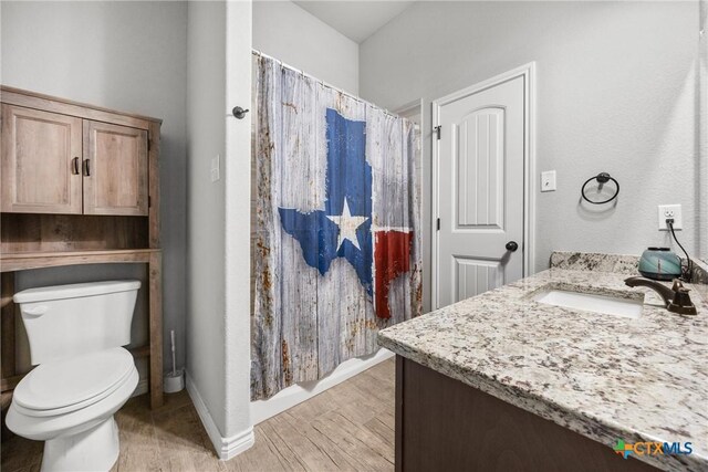 7511 Wind Chime Way, Temple, TX 76502 - full bathroom featuring vanity, wood finished floors, and curtained shower