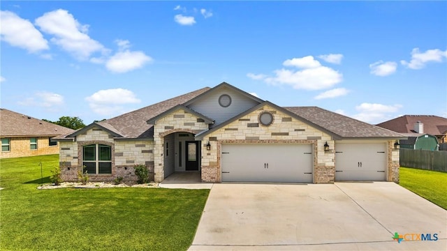 7511 Wind Chime Way, Temple, TX 76502 - french country inspired facade featuring an attached garage, driveway, roof with shingles, stone siding, and brick siding