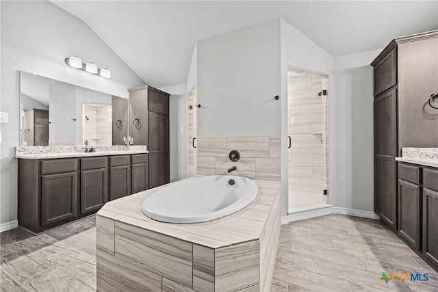 7511 Wind Chime Way, Temple, TX 76502 - full bath with vaulted ceiling, a stall shower, vanity, and a garden tub