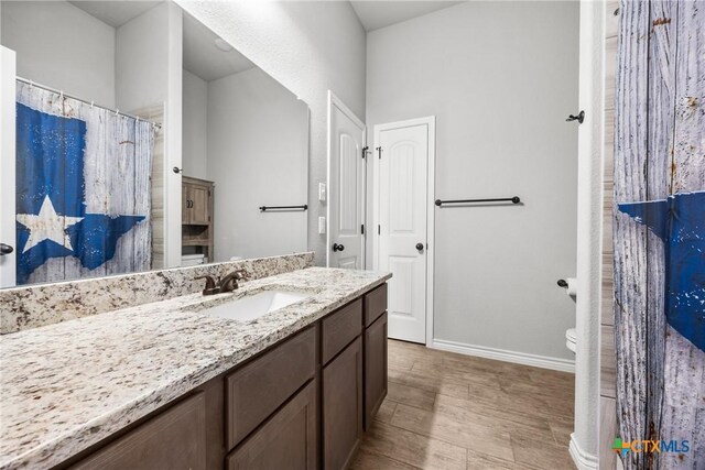 7511 Wind Chime Way, Temple, TX 76502 - full bathroom with vanity and wood finished floors