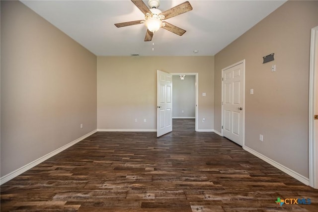 196 Garza Rd, Port Lavaca, TX 77979 - unfurnished bedroom featuring dark wood finished floors and ceiling fan