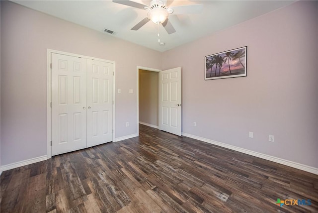 196 Garza Rd, Port Lavaca, TX 77979 - unfurnished bedroom featuring dark wood-style flooring, a closet, and a ceiling fan