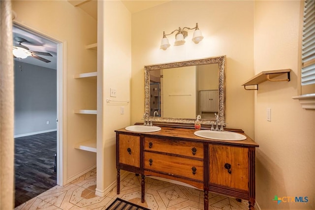 196 Garza Rd, Port Lavaca, TX 77979 - full bath with double vanity and a ceiling fan