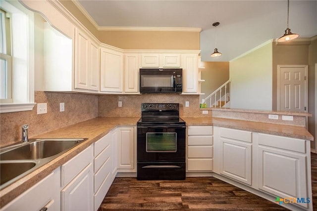 196 Garza Rd, Port Lavaca, TX 77979 - kitchen featuring black appliances, backsplash, a peninsula, crown molding, and white cabinets