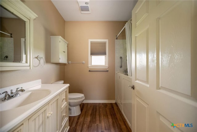 196 Garza Rd, Port Lavaca, TX 77979 - bathroom featuring vanity, wood finished floors, and tub / shower combination