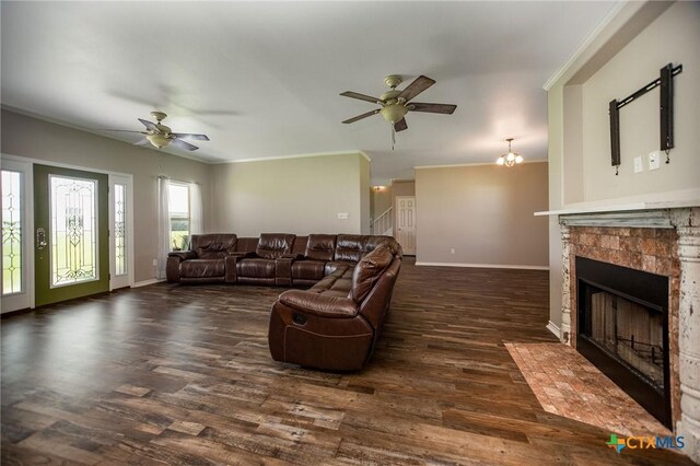196 Garza Rd, Port Lavaca, TX 77979 - living area featuring a ceiling fan, a tile fireplace, ornamental molding, and wood finished floors