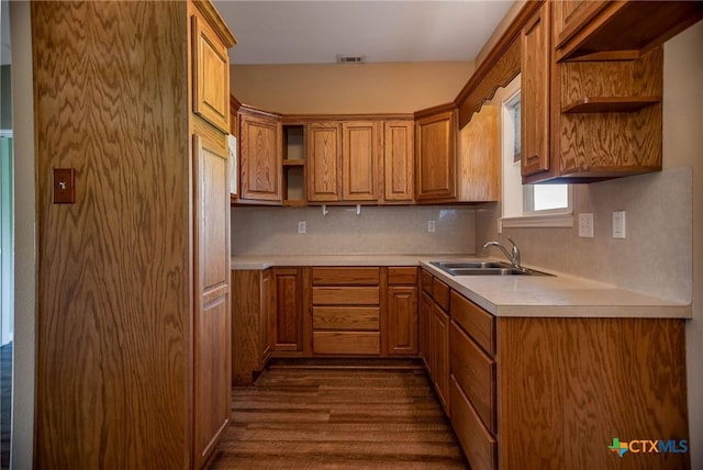 196 Garza Rd, Port Lavaca, TX 77979 - kitchen with open shelves, dark wood-style floors, light countertops, and tasteful backsplash