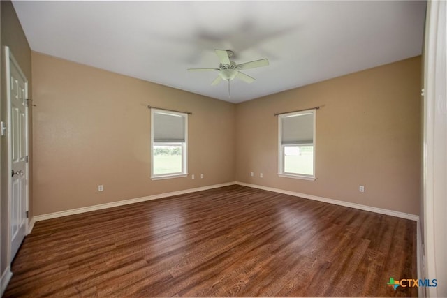 196 Garza Rd, Port Lavaca, TX 77979 - unfurnished room featuring a ceiling fan and dark wood-style floors