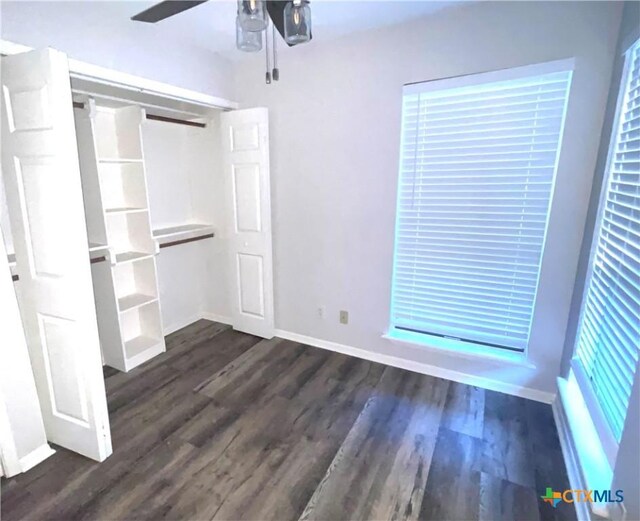 420 Londonderry Dr, Victoria, TX 77901 - unfurnished bedroom featuring dark wood-style flooring, baseboards, and a ceiling fan