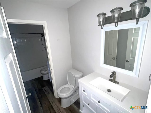 420 Londonderry Dr, Victoria, TX 77901 - bathroom featuring toilet, wood finished floors, and vanity