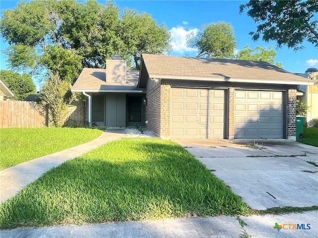 420 Londonderry Dr, Victoria, TX 77901 - single story home with a garage, brick siding, concrete driveway, and a chimney