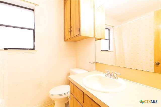 bathroom with vanity and toilet