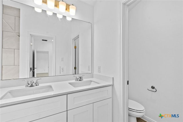 9820 Tarabon Dr, Killeen, TX 76542 - bathroom featuring double vanity and toilet