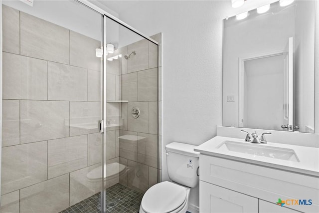 9820 Tarabon Dr, Killeen, TX 76542 - bathroom with vanity, a shower stall, and a textured wall