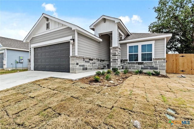 9820 Tarabon Dr, Killeen, TX 76542 - single story home with an attached garage, board and batten siding, driveway, stone siding, and a shingled roof