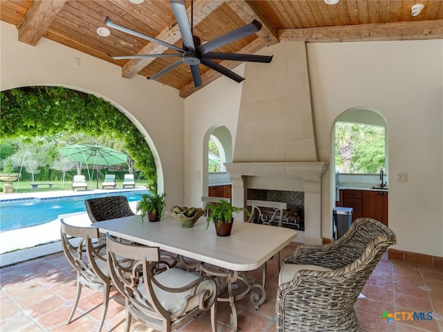 view of patio with sink and ceiling fan