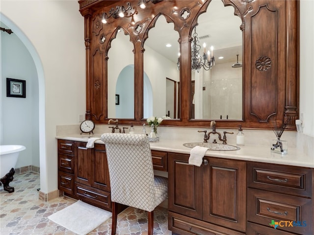 bathroom with walk in shower, vanity, and a notable chandelier